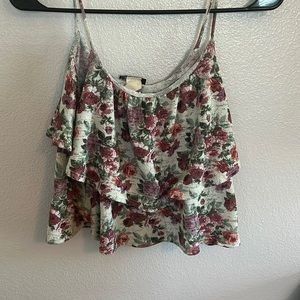 Floral rose, cropped blouse with light cleavage may be worn two or three times